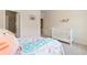 Bright bedroom featuring a crib, a changing table, neutral walls, and large windows at 2289 Emerald Sky Dr, Smyrna, GA 30080