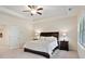 Comfortable bedroom with a queen bed, two side tables, and a large window for natural light at 2289 Emerald Sky Dr, Smyrna, GA 30080