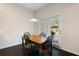 Cozy breakfast nook with a wooden table, chairs, and natural light from the backyard at 2289 Emerald Sky Dr, Smyrna, GA 30080