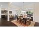 Open concept dining room flows into kitchen and living room; hardwood floors; ample natural light at 2289 Emerald Sky Dr, Smyrna, GA 30080
