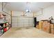 Spacious garage with ample storage, featuring shelving, boxes, and an automatic door opener at 2289 Emerald Sky Dr, Smyrna, GA 30080