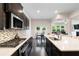 The kitchen boasts stainless steel appliances, a center island, and an open floor plan at 2289 Emerald Sky Dr, Smyrna, GA 30080