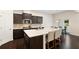 Modern eat-in kitchen features an island with seating and stainless steel appliances at 2289 Emerald Sky Dr, Smyrna, GA 30080