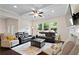 This living room is filled with natural light and features a ceiling fan and comfortable seating arrangements at 2289 Emerald Sky Dr, Smyrna, GA 30080