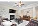 Open-concept living area with fireplace, built-ins, and adjacent dining room, perfect for entertaining at 2289 Emerald Sky Dr, Smyrna, GA 30080