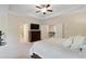 Bright main bedroom featuring a tray ceiling, television, and easy access to the staircase at 2289 Emerald Sky Dr, Smyrna, GA 30080