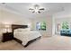 Serene main bedroom with a tray ceiling, a large bed, and natural light from the windows at 2289 Emerald Sky Dr, Smyrna, GA 30080
