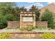 The Terraces at Cumberland community sign is surrounded by beautiful landscaping and stonework at 2289 Emerald Sky Dr, Smyrna, GA 30080