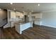 Kitchen with white cabinets, granite countertops, and hardwood floors at 258 Depot Landing Rd # 53, Auburn, GA 30011