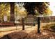 Roy E. Parks Community Playground sign on 5th street surrounded by a metal fence at 258 Depot Landing Rd # 53, Auburn, GA 30011