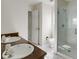 Bright bathroom featuring dual sinks with a glass-enclosed shower, and toilet at 270 Grapevine Run, Sandy Springs, GA 30350