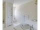 Bright bathroom with dual sink vanity and tiled floor, featuring a shower-tub combo and toilet at 270 Grapevine Run, Sandy Springs, GA 30350
