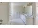 Bright bathroom with dual sink vanity, large mirror, and tiled shower at 270 Grapevine Run, Sandy Springs, GA 30350