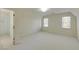 Bright bedroom featuring a bathroom and two windows at 270 Grapevine Run, Sandy Springs, GA 30350