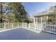 Wooden deck with white railings overlooks a wooded area at 270 Grapevine Run, Sandy Springs, GA 30350