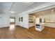 Open-concept kitchen with hardwood floors, large island, and white cabinetry at 270 Grapevine Run, Sandy Springs, GA 30350