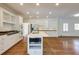 Modern kitchen featuring white cabinets, stainless steel appliances, and kitchen island at 270 Grapevine Run, Sandy Springs, GA 30350