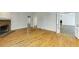 Bright living room with fireplace, hardwood floors, open floor plan, and multiple access points at 270 Grapevine Run, Sandy Springs, GA 30350