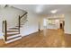 Bright living room showcasing staircase, hardwood floors, fireplace, and open-concept design at 270 Grapevine Run, Sandy Springs, GA 30350