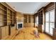Warm and inviting study with custom built-ins, a fireplace, and hardwood floors at 270 Grapevine Run, Sandy Springs, GA 30350