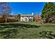 Sprawling backyard featuring a lush green lawn and wooden fence for added privacy at 705 Chanson Sw Dr, Marietta, GA 30064