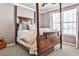 Bedroom featuring wood framed bed, neutral paint and window with curtains at 705 Chanson Sw Dr, Marietta, GA 30064