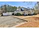 Charming community clubhouse surrounded by lush landscaping and an adjacent parking area at 705 Chanson Sw Dr, Marietta, GA 30064