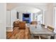 Open-concept living space seamlessly connects the dining area, highlighted by an archway and contemporary design elements at 705 Chanson Sw Dr, Marietta, GA 30064