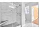 Bathroom featuring shower with glass door, seat and marble tile at 1575 Ridenour Nw Pkwy # 1119, Kennesaw, GA 30152