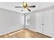 Bedroom with wood flooring, ceiling fan, and closet at 1575 Ridenour Nw Pkwy # 1119, Kennesaw, GA 30152