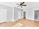 Spacious bedroom features wood floors, ceiling fan, and natural light at 1575 Ridenour Nw Pkwy # 1119, Kennesaw, GA 30152