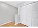 Hallway view featuring closet with shutter doors and wood flooring at 1575 Ridenour Nw Pkwy # 1119, Kennesaw, GA 30152