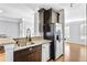 Contemporary kitchen area with stainless steel dishwasher and refrigerator at 1575 Ridenour Nw Pkwy # 1119, Kennesaw, GA 30152