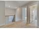 Upstairs hallway features carpet, a staircase view, and entryways to bedrooms and bathrooms at 4039 Andover Cir, Mcdonough, GA 30252