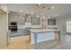 Modern kitchen with gray cabinets, quartz countertops, and a large central island at 4039 Andover Cir, Mcdonough, GA 30252