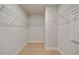 Well-lit walk-in closet with wire shelving maximizes storage and organization at 4039 Andover Cir, Mcdonough, GA 30252