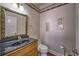 Bathroom featuring decorative mirror, vanity, and updated fixtures at 520 Camp Perrin Rd, Lawrenceville, GA 30043