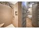 Elegant bathroom featuring a tile shower, decorative wallpaper, and an adjacent bathtub at 520 Camp Perrin Rd, Lawrenceville, GA 30043