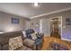 Bedroom view featuring hardwood floors, comfortable seating, and ample light at 520 Camp Perrin Rd, Lawrenceville, GA 30043