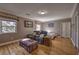 Bedroom featuring hardwood floors, windows, comfortable seating, and ample light at 520 Camp Perrin Rd, Lawrenceville, GA 30043