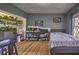 Bedroom featuring natural light, hardwood floors, and fish tanks at 520 Camp Perrin Rd, Lawrenceville, GA 30043