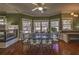 Bright dining area featuring large windows, a fireplace, and a breakfast bar at 520 Camp Perrin Rd, Lawrenceville, GA 30043