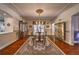 Dining room with a traditional chandelier and patterned area rug at 520 Camp Perrin Rd, Lawrenceville, GA 30043