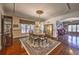 Charming dining room with a classic chandelier and area rug at 520 Camp Perrin Rd, Lawrenceville, GA 30043