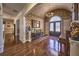 A foyer reveals hardwood floors, detailed trim, and stylish lighting creating a welcoming ambiance at 520 Camp Perrin Rd, Lawrenceville, GA 30043