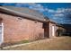 Brick home exterior with white trim and a lush green lawn at 520 Camp Perrin Rd, Lawrenceville, GA 30043