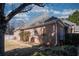 Charming brick home exterior with manicured lawn and bright sky overhead at 520 Camp Perrin Rd, Lawrenceville, GA 30043