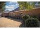 Brick exterior of home featuring lush landscaping, a well-manicured lawn, and mature greenery at 520 Camp Perrin Rd, Lawrenceville, GA 30043