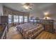 A well-lit main bedroom featuring a bay window and charming decor at 520 Camp Perrin Rd, Lawrenceville, GA 30043