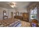 Cozy main bedroom showcasing a bay window and unique decor at 520 Camp Perrin Rd, Lawrenceville, GA 30043